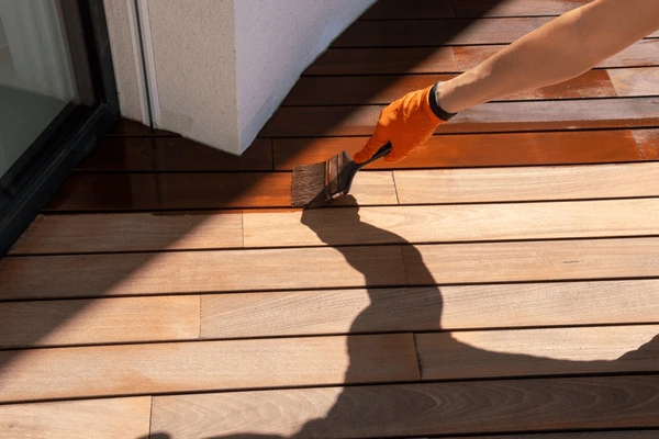 Sealed outdoor wood deck protected from moisture and seasonal weather exposure