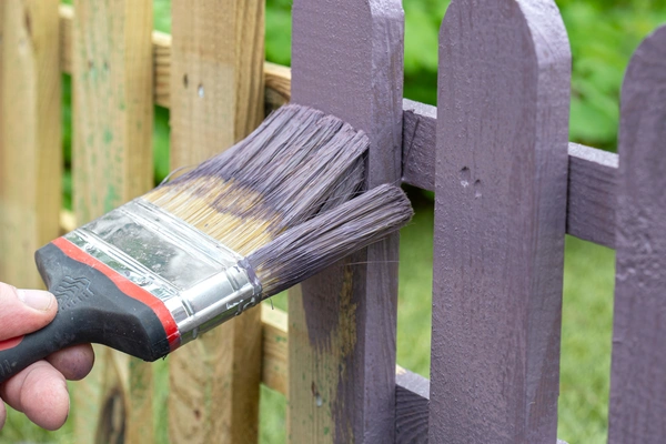 Professionally sealed wooden fence with natural finish and protected exterior boards